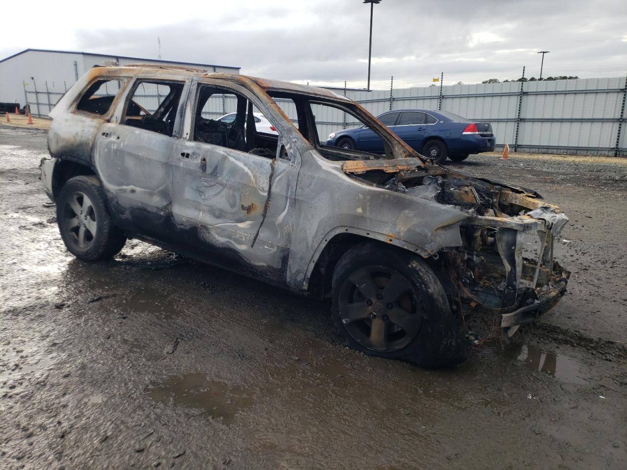 2011 Jeep Grand Cherokee VIN 1J4RS4GG3BC524315 Copart auction photo, burn damage thumbnail 4