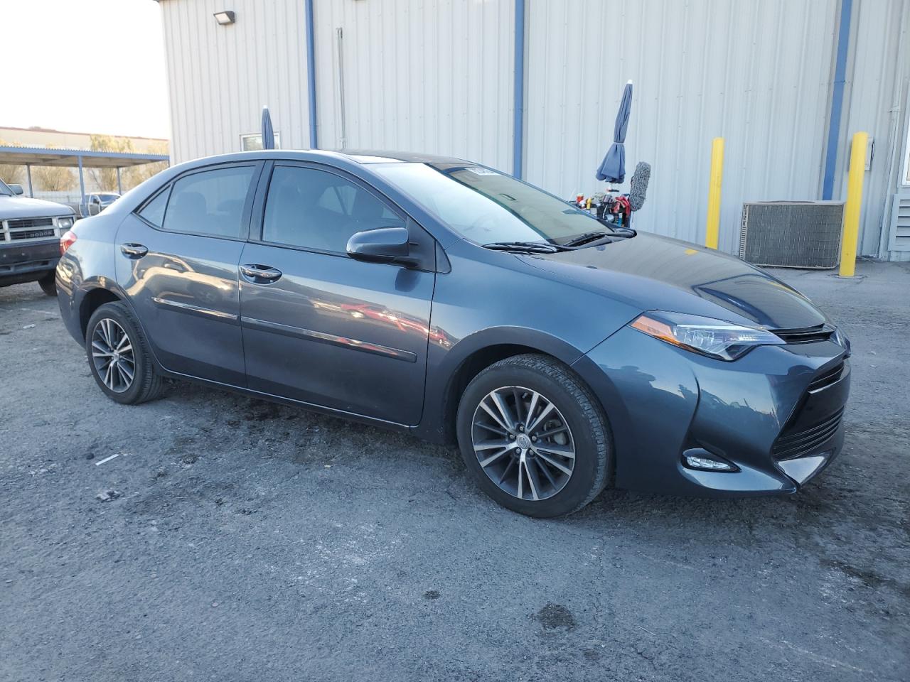 2018 Toyota Corolla VIN 2T1BURHE7JC100721 Copart auction photo, side damage thumbnail 4