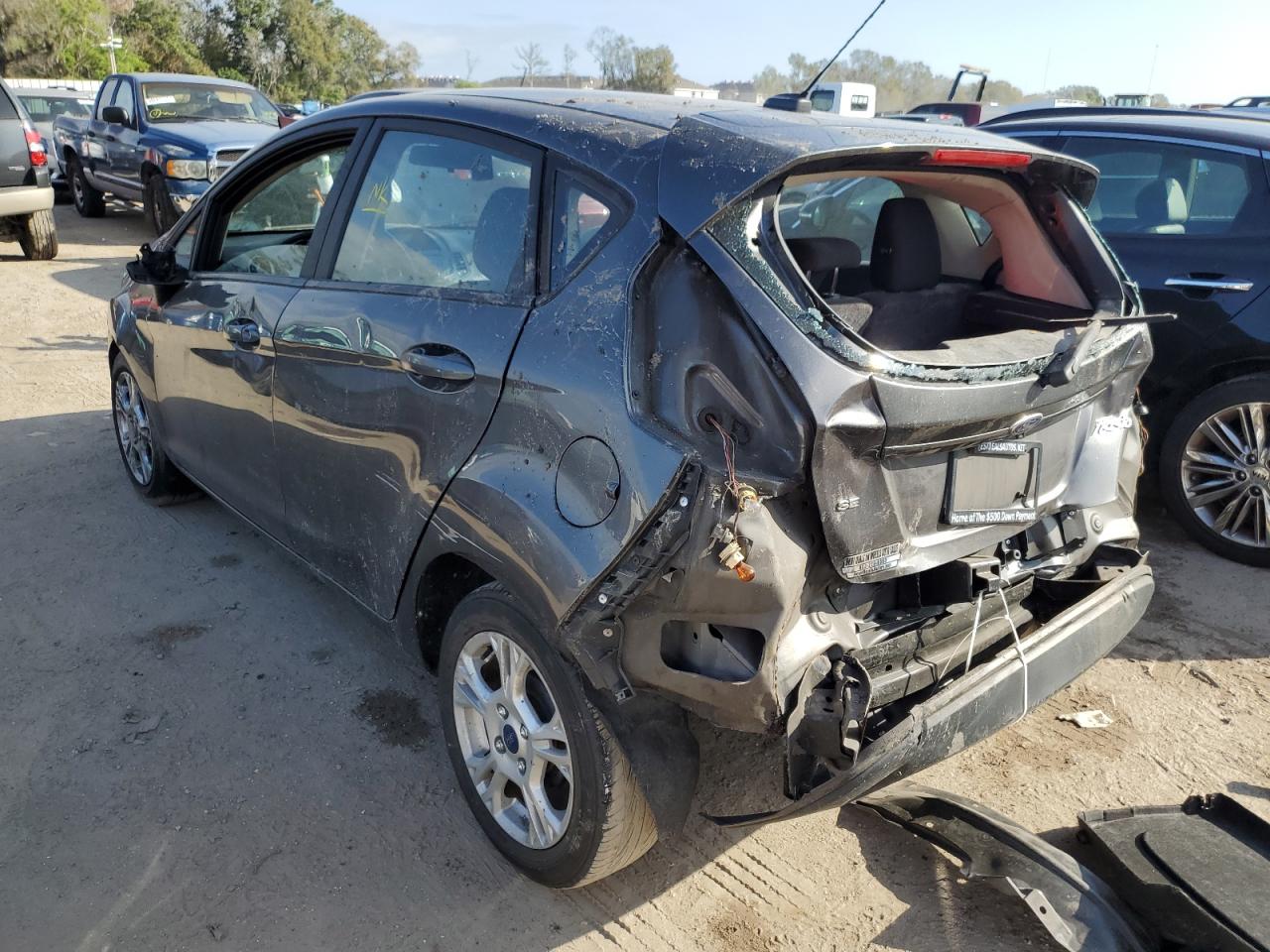 2015 Ford Fiesta VIN 3FADP4EJ1FM167629 Copart auction photo, rear end damage thumbnail 2