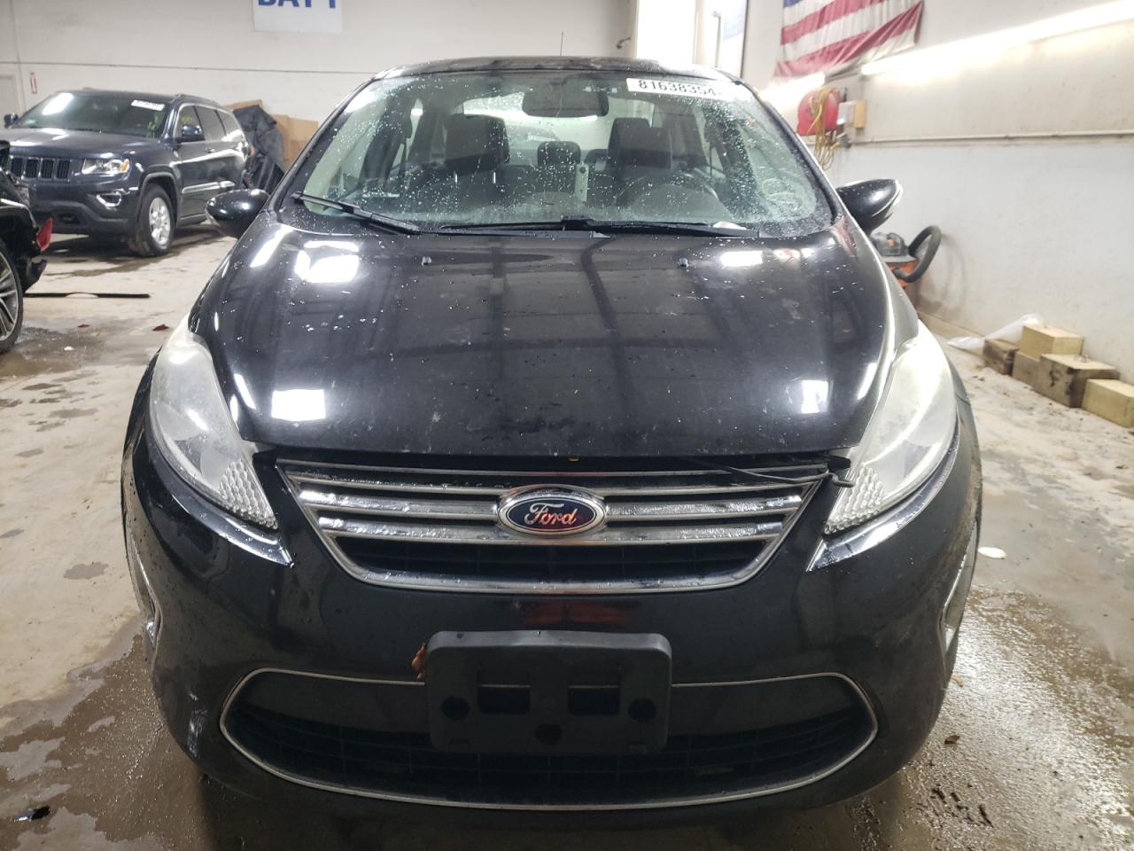 2012 Ford Fiesta VIN 3FADP4CJ9CM153055 Copart auction photo, side damage thumbnail 5