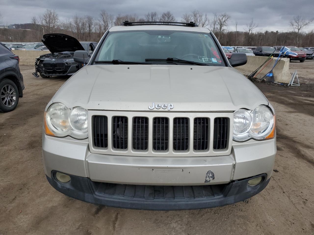 2010 Jeep Grand Cherokee VIN 1J4RR4GT1AC119884 Copart auction photo, front end / minor dent/scratches damage thumbnail 5