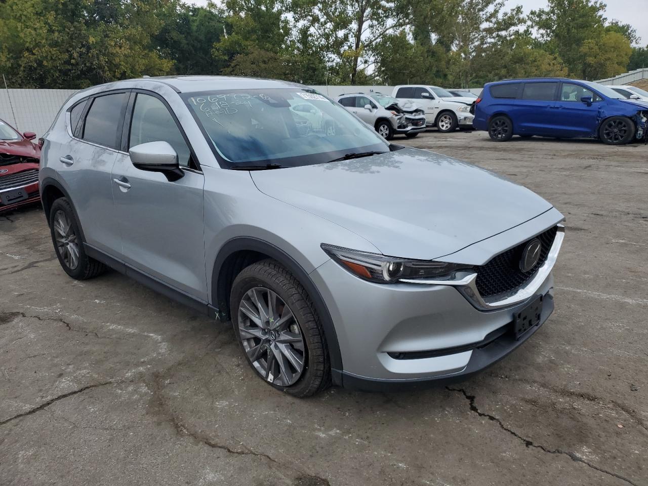 2021 Mazda CX-5 VIN JM3KFADM7M1339047 Copart auction photo, all over damage thumbnail 4