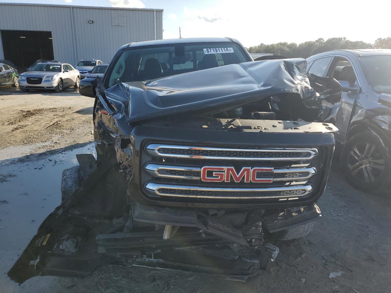 2015 GMC Canyon VIN 1GTH6BE33F1199189 Copart auction photo, all over damage thumbnail 5