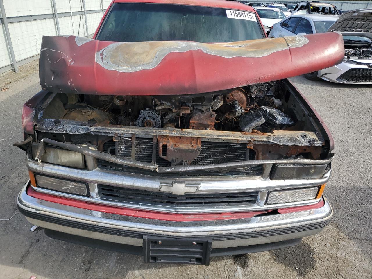 1999 Chevrolet Tahoe VIN 1GNEC13R2XJ355423 Copart auction photo, burn - engine damage thumbnail 12