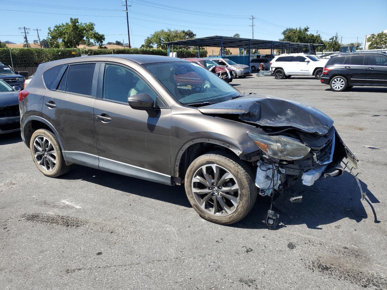 2016 Mazda CX-5 VIN JM3KE4DY3G0786590 Copart auction photo, front end / minor dent/scratches damage thumbnail 4