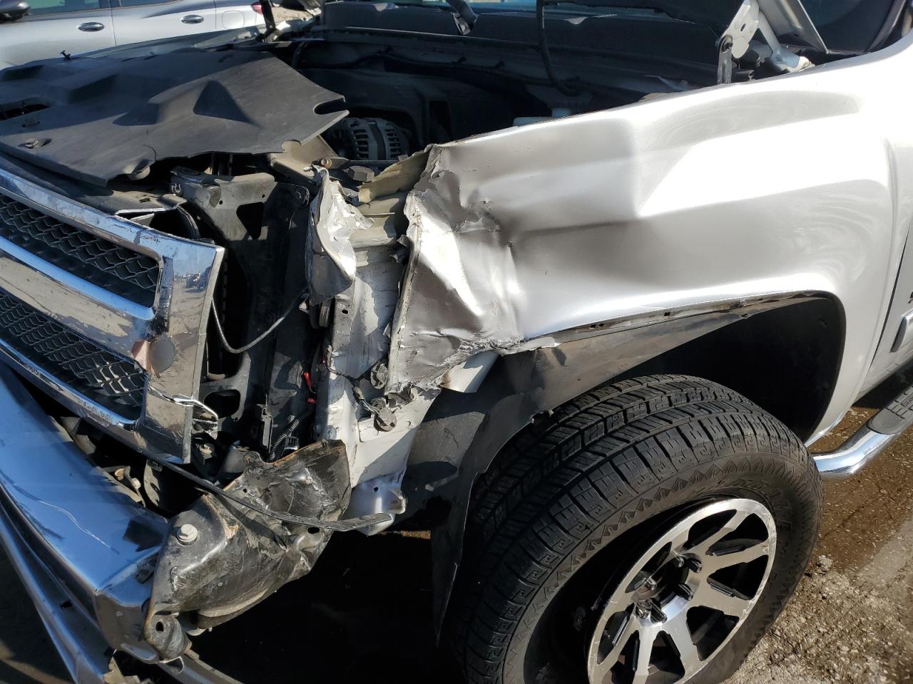 2012 Chevrolet Silverado VIN 3GCPCSEA8CG197129 Copart auction photo, front end / side damage thumbnail 9