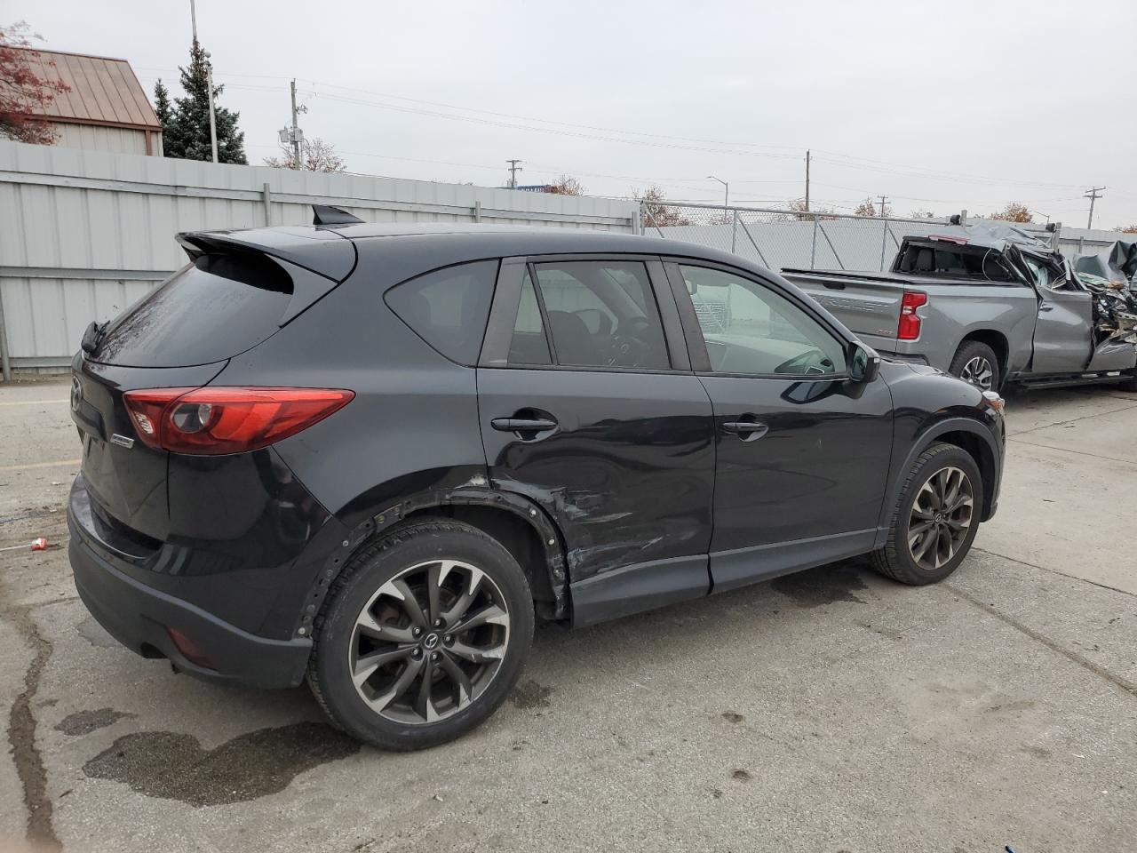 2016 Mazda CX-5 VIN JM3KE4DYXG0701969 Copart auction photo, side / rear end damage thumbnail 3
