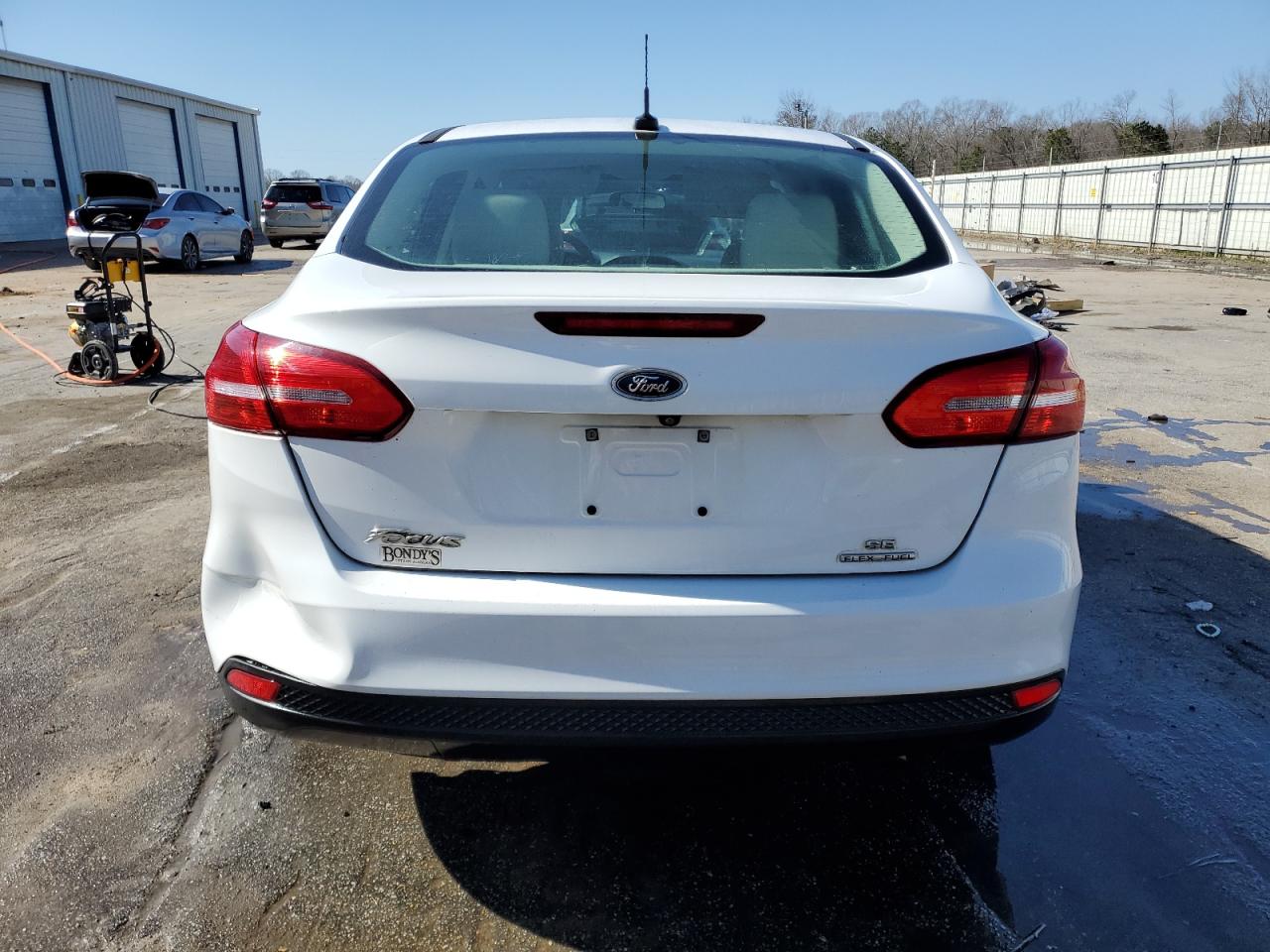 2016 Ford Focus VIN 1FADP3F21GL393349 Copart auction photo, side / rear end damage thumbnail 6