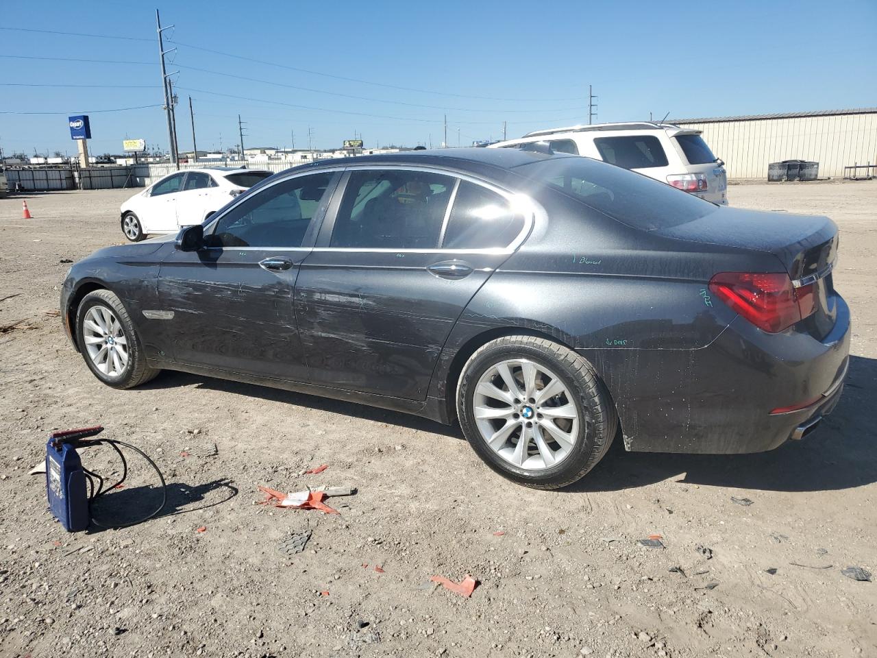 2015 BMW 7er VIN WBAYA6C52FGK16391 Copart auction photo, side / front end damage thumbnail 2