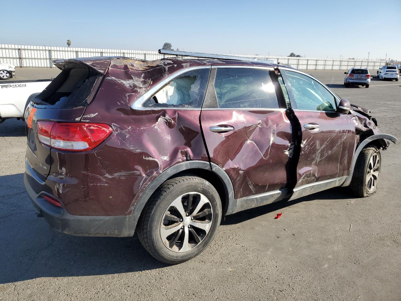 2016 KIA Sorento VIN 5XYPH4A5XGG183081 Copart auction photo, rollover damage thumbnail 3