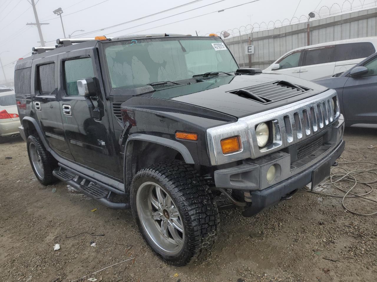 2003 Hummer H2 VIN 5GRGN23U83H143843 Copart auction photo, stripped damage thumbnail 4