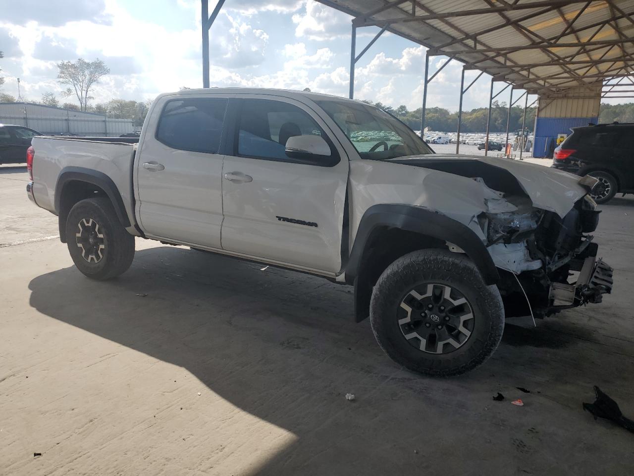 2018 Toyota Tacoma VIN 3TMCZ5AN3JM136454 Copart auction photo, front end / minor dent/scratches damage thumbnail 4