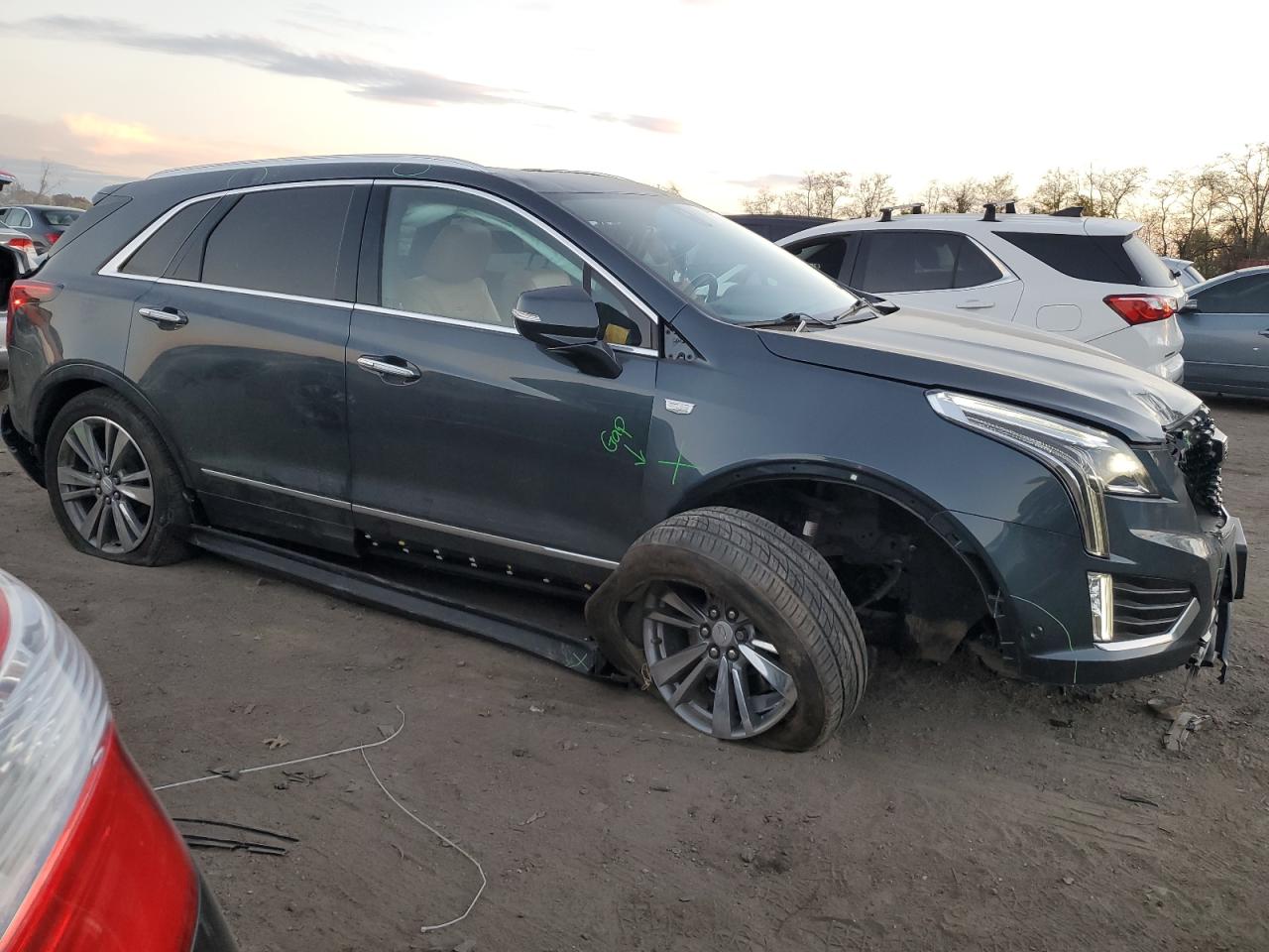 2021 Cadillac XT5 VIN 1GYKNDRS5MZ149683 Copart auction photo, undercarriage / all over damage thumbnail 4