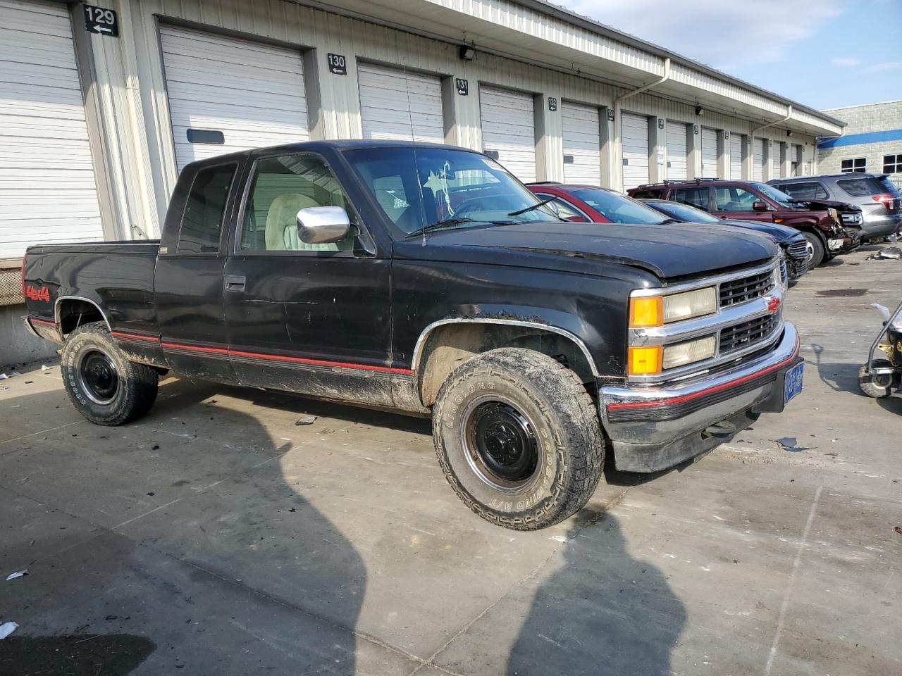 1994 Chevrolet GMT-400 VIN 2GCFK29K8R1315568 Copart auction photo, side damage thumbnail 4