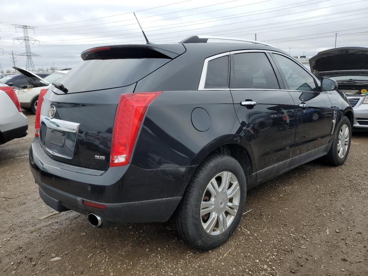 2012 Cadillac SRX VIN 3GYFNDE34CS561640 Copart auction photo, minor dent/scratches damage thumbnail 3