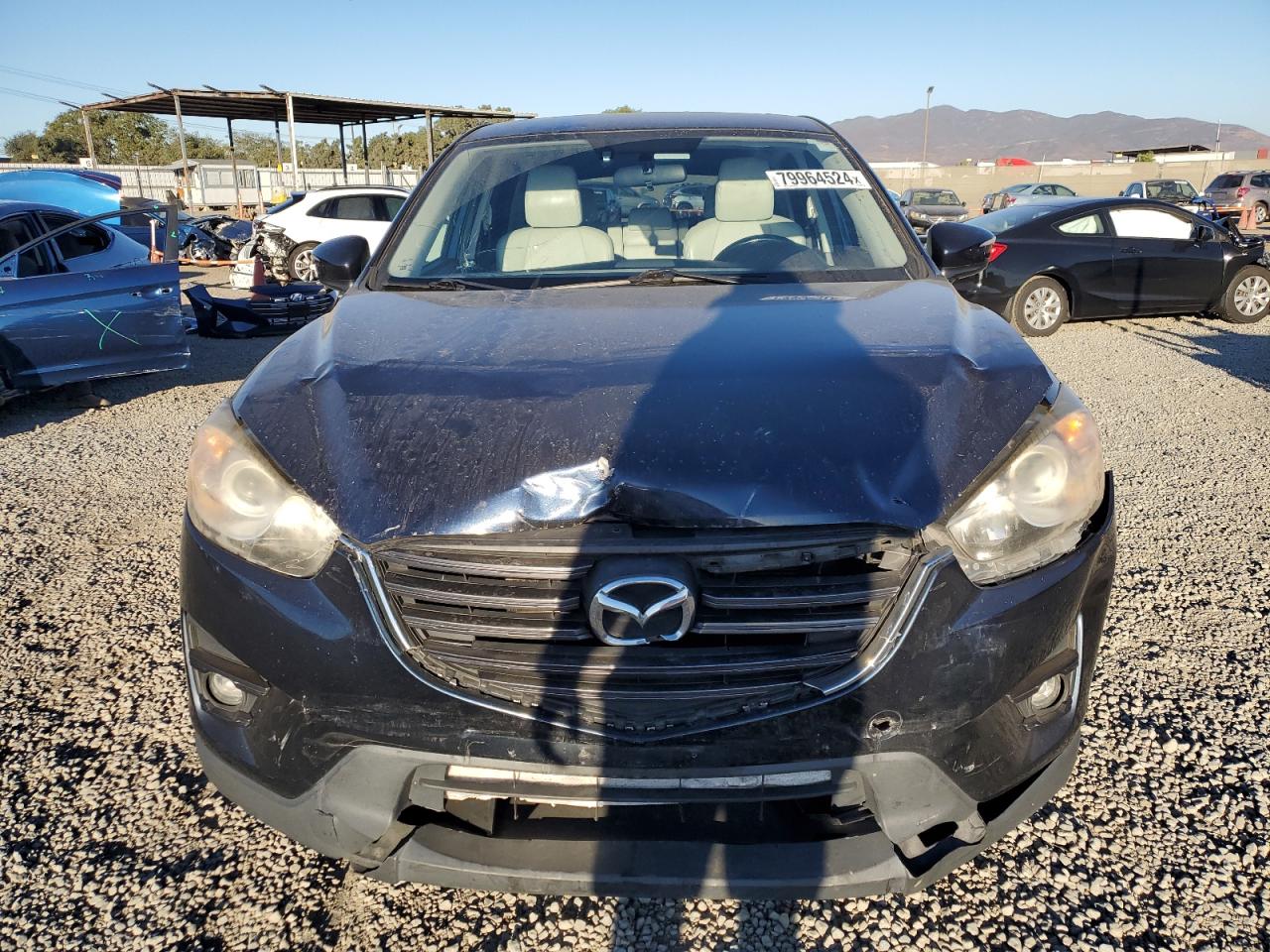2016 Mazda CX-5 VIN JM3KE2DY5G0685779 Copart auction photo, front end / minor dent/scratches damage thumbnail 5