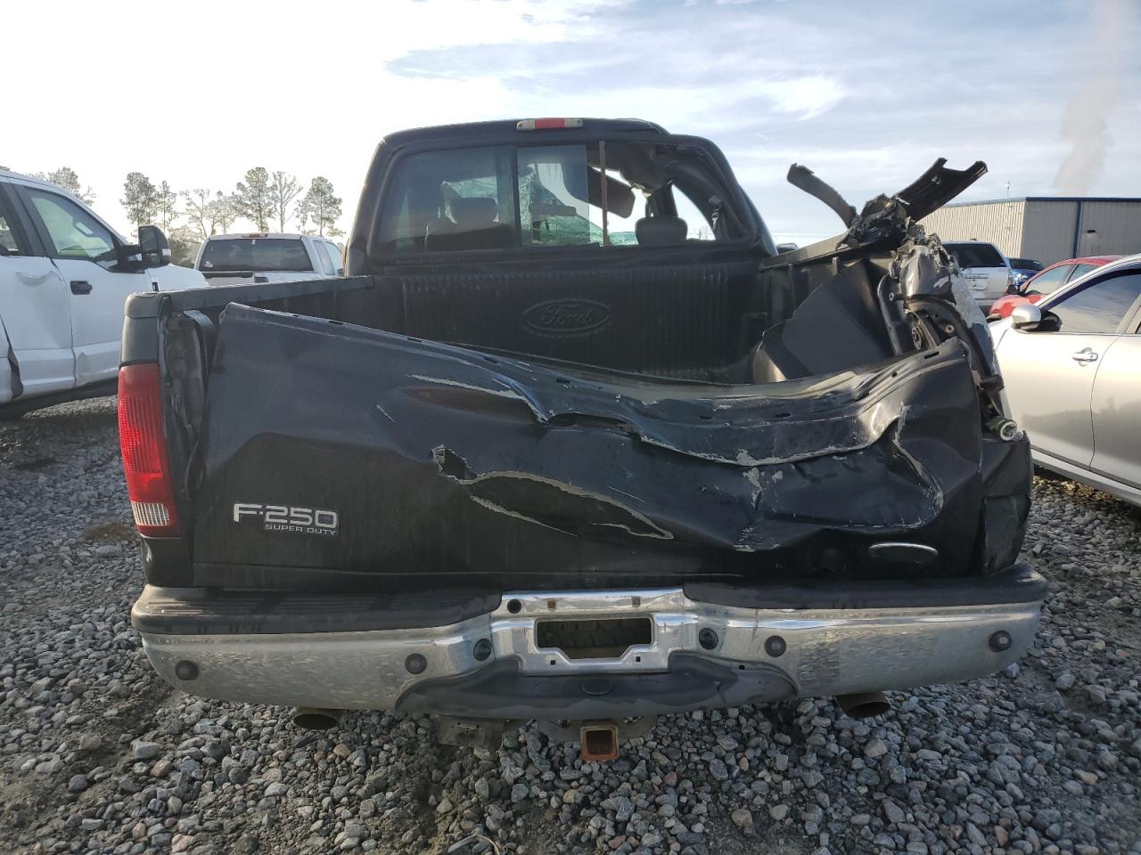 2004 Ford F250 VIN 1FTNX21L14EA69584 Copart auction photo, rollover damage thumbnail 6