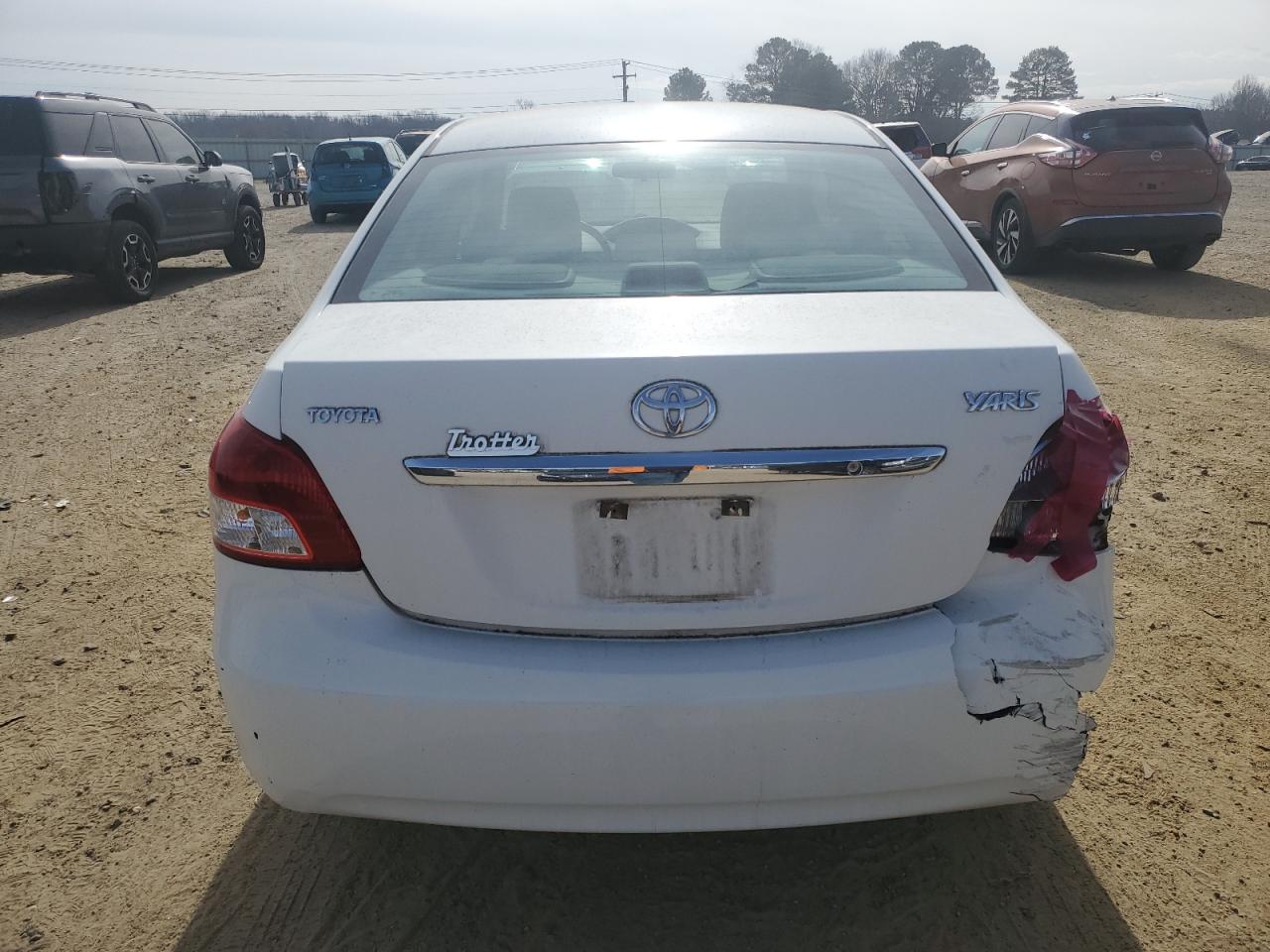 2010 Toyota Yaris VIN JTDBT4K31A4062709 Copart auction photo, rear end / minor dent/scratches damage thumbnail 6