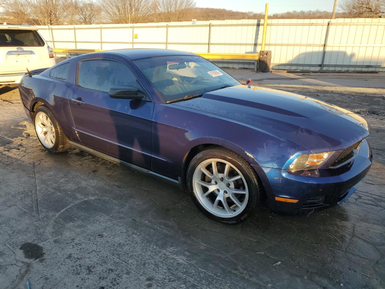 2012 Ford Mustang VIN 1ZVBP8AM5C5277283 Copart auction photo, side / rear end damage thumbnail 4