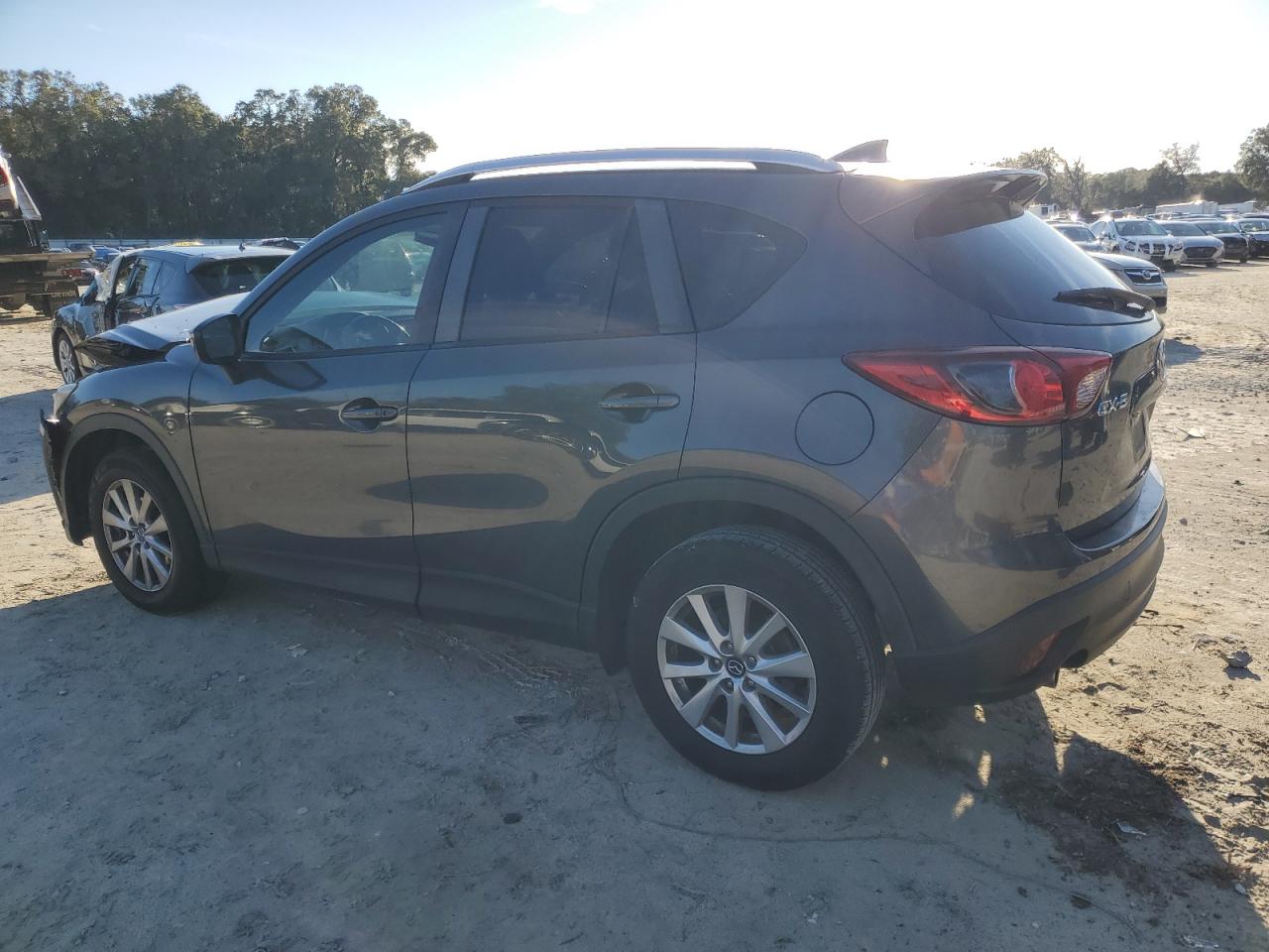 2016 Mazda CX-5 VIN JM3KE2CY1G0782592 Copart auction photo, front end / minor dent/scratches damage thumbnail 2