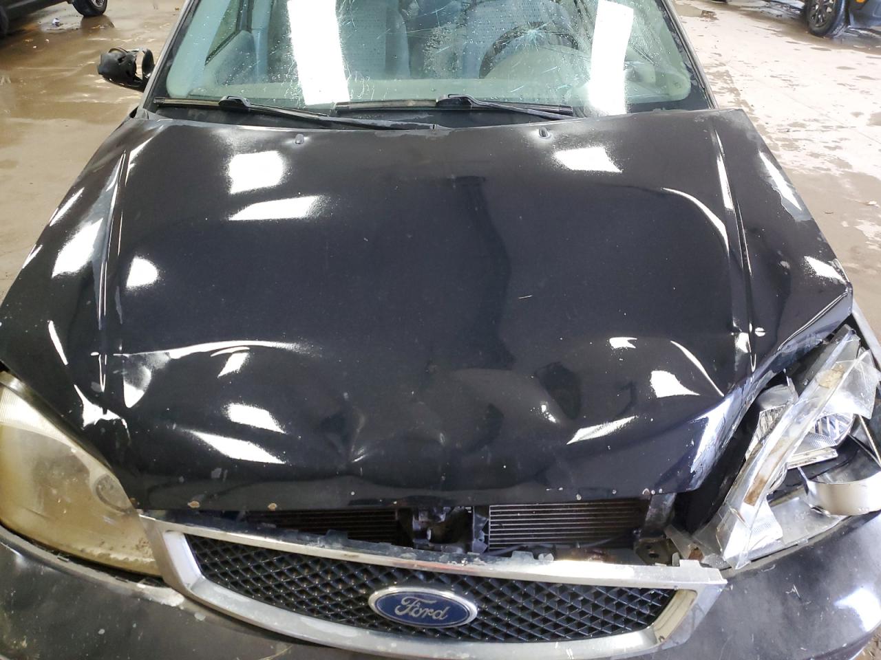 2005 Ford Focus VIN 1FAFP34N35W138316 Copart auction photo, all over damage thumbnail 11