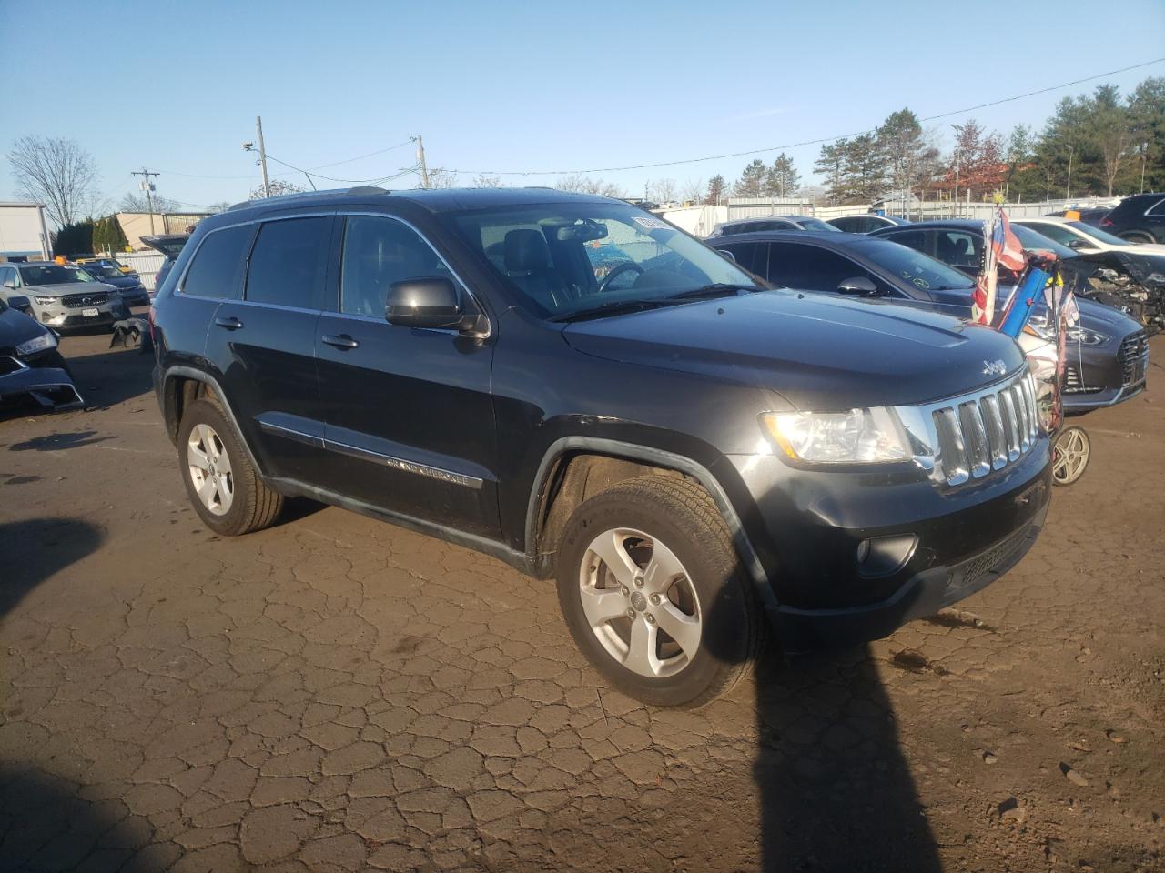 2011 Jeep Grand Cherokee VIN 1J4RR4GT7BC542194 Copart auction photo, side / front end damage thumbnail 4