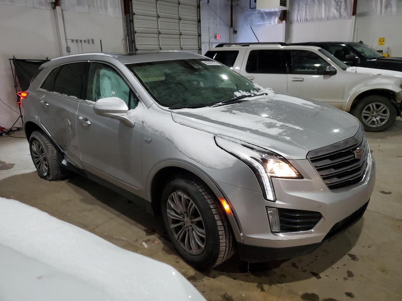 2019 Cadillac XT5 VIN 1GYKNCRS4KZ240984 Copart auction photo, side damage thumbnail 4