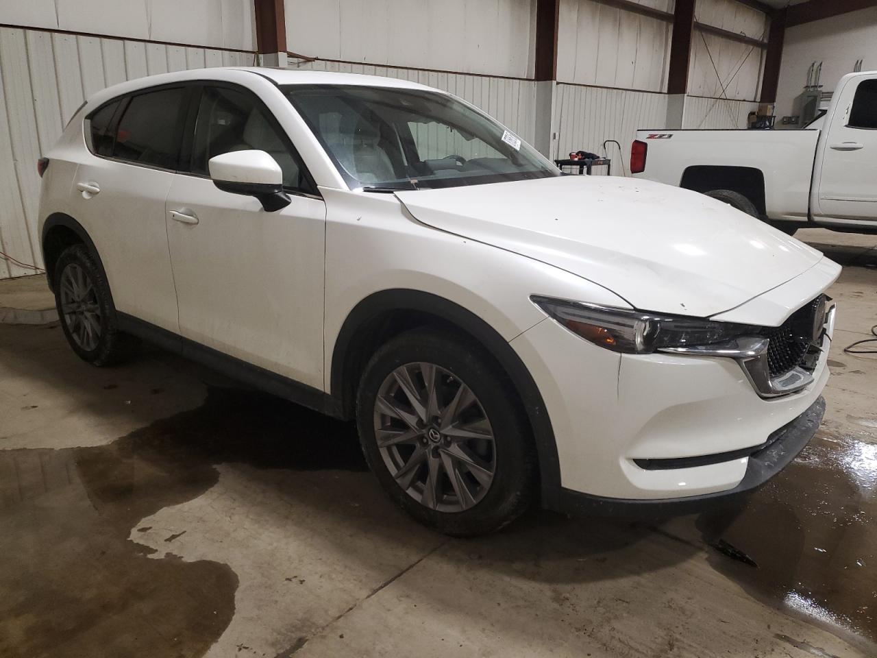 2020 Mazda CX-5 VIN JM3KFBAY8L0823682 Copart auction photo, front end / side damage thumbnail 4