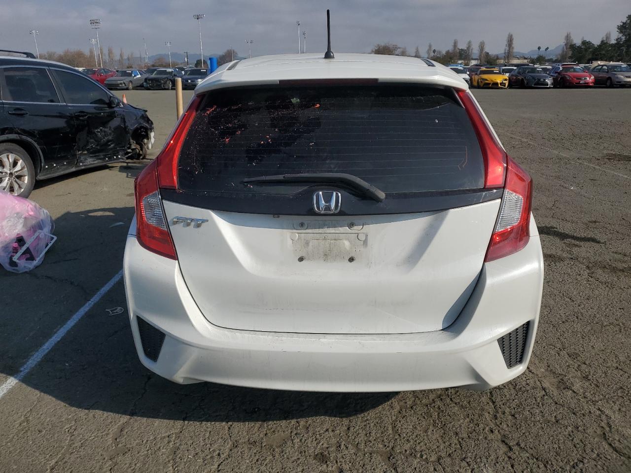 2016 Honda Fit VIN JHMGK5H51GX008405 Copart auction photo, side / front end damage thumbnail 6