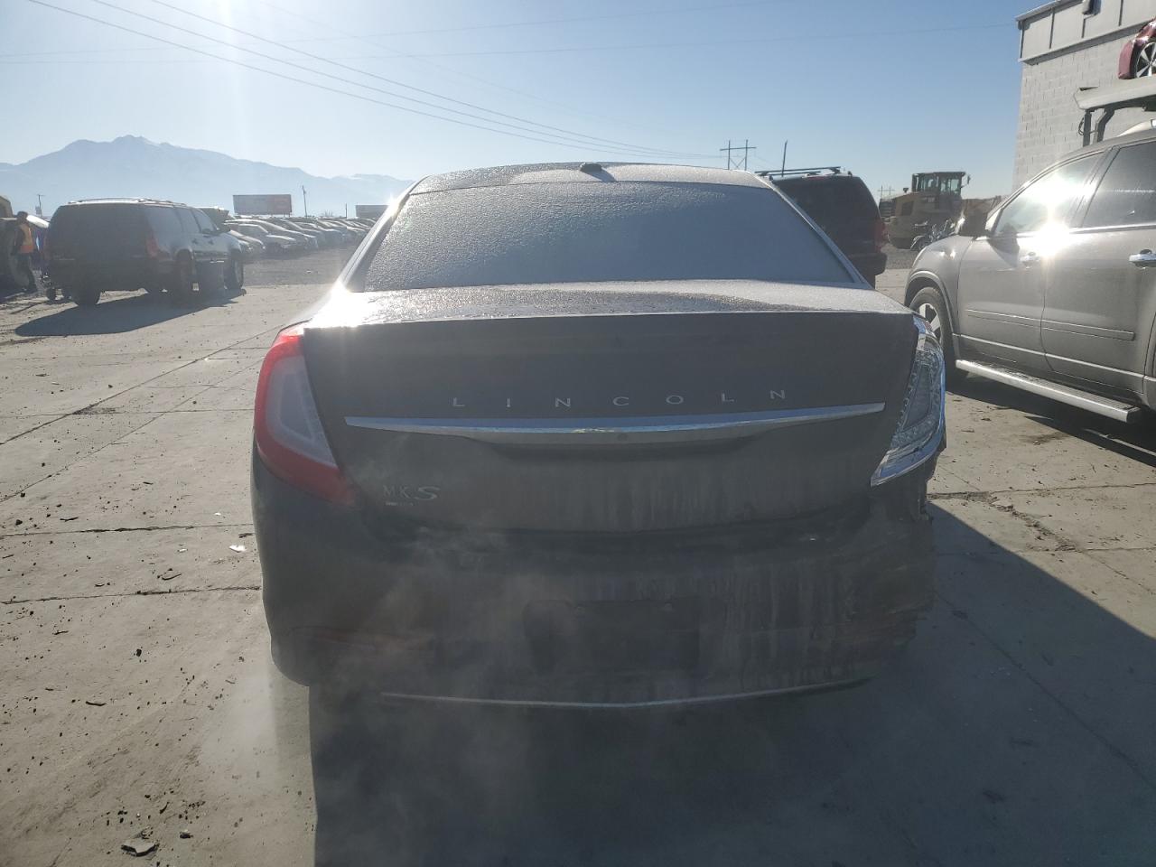 2015 Lincoln MKS VIN 1LNHL9FT4FG605991 Copart auction photo, rear end / side damage thumbnail 6