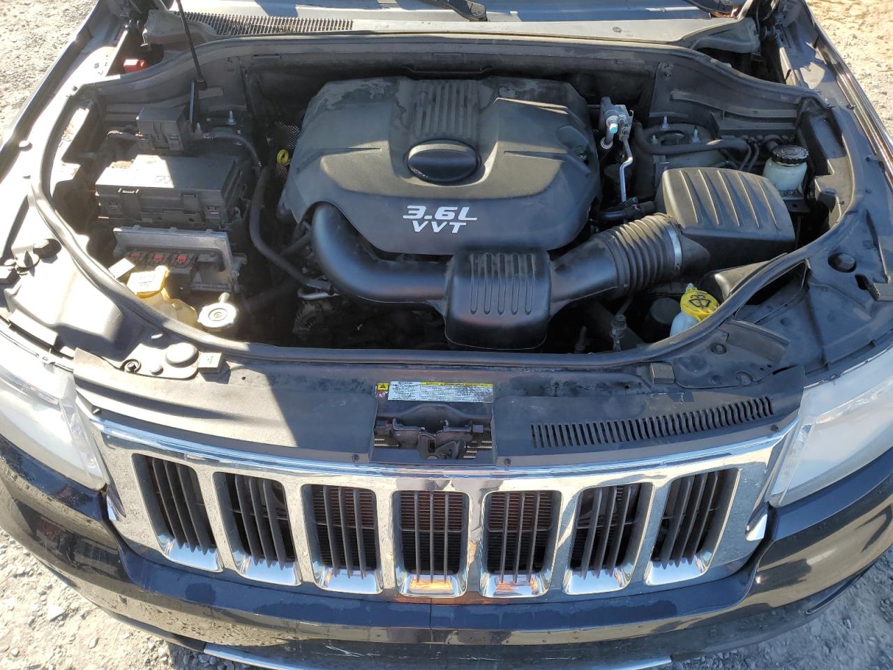2012 Jeep Grand Cherokee VIN 1C4RJEBGXCC230207 Copart auction photo, side / damage history damage thumbnail 12