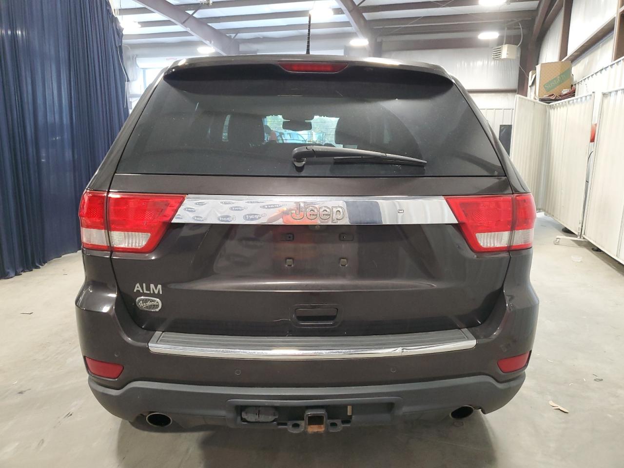 2012 Jeep Grand Cherokee VIN 1C4RJECT5CC277561 Copart auction photo, side damage thumbnail 6