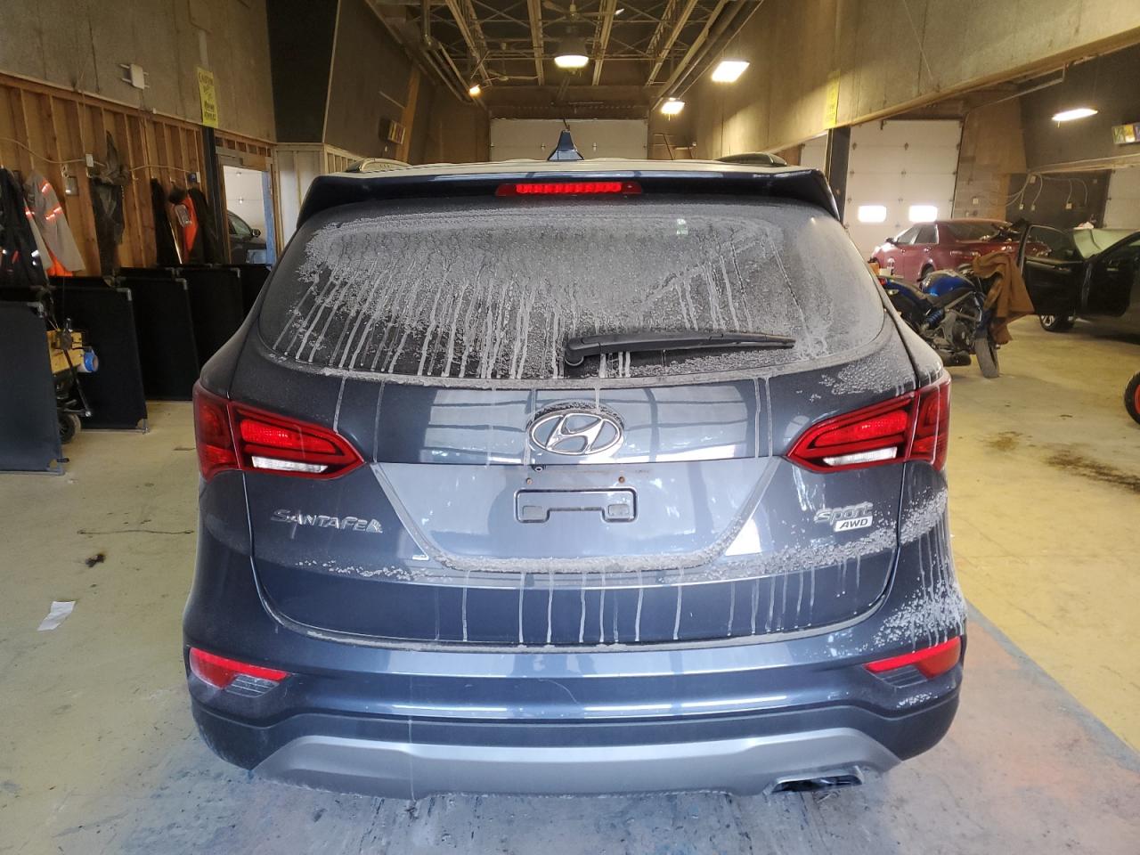 2018 Hyundai Santa Fe VIN 5NMZUDLB6JH066439 Copart auction photo, front end / minor dent/scratches damage thumbnail 6