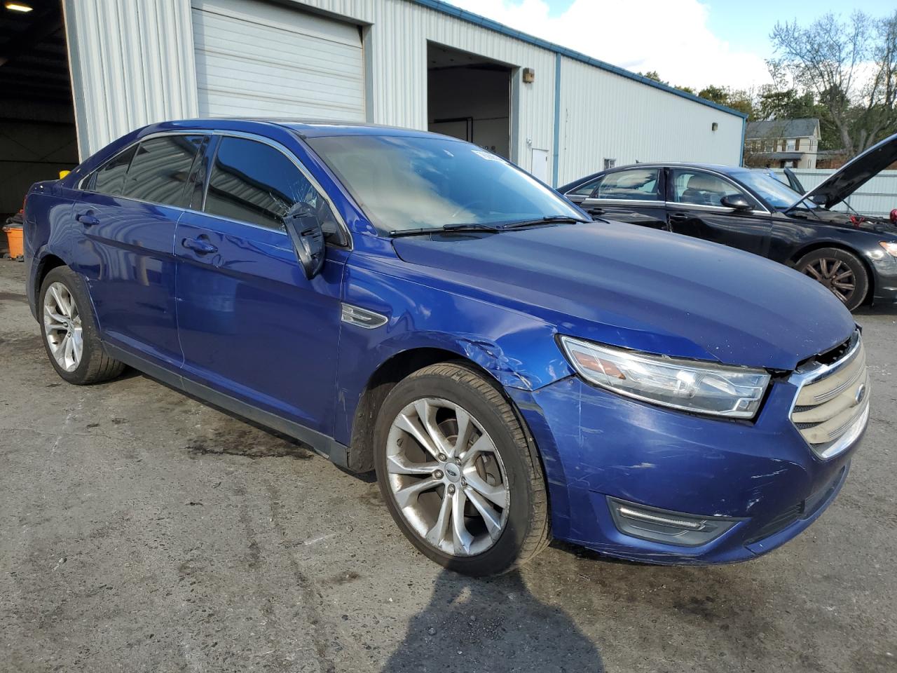 2013 Ford Taurus VIN 1FAHP2E81DG127819 Copart auction photo, side / front end damage thumbnail 4