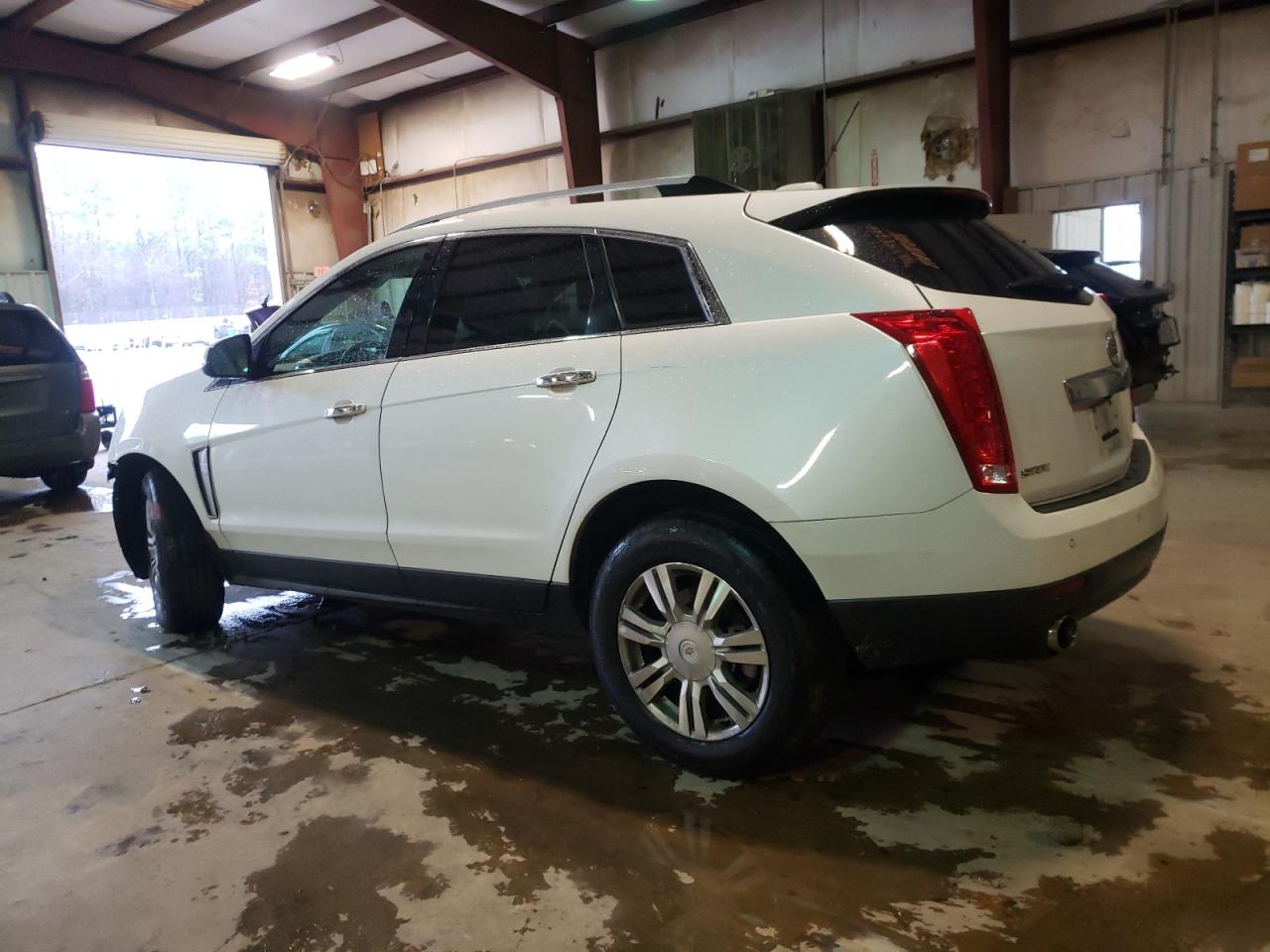2015 Cadillac SRX VIN 3GYFNBE3XFS560713 Copart auction photo, front end / side damage thumbnail 2