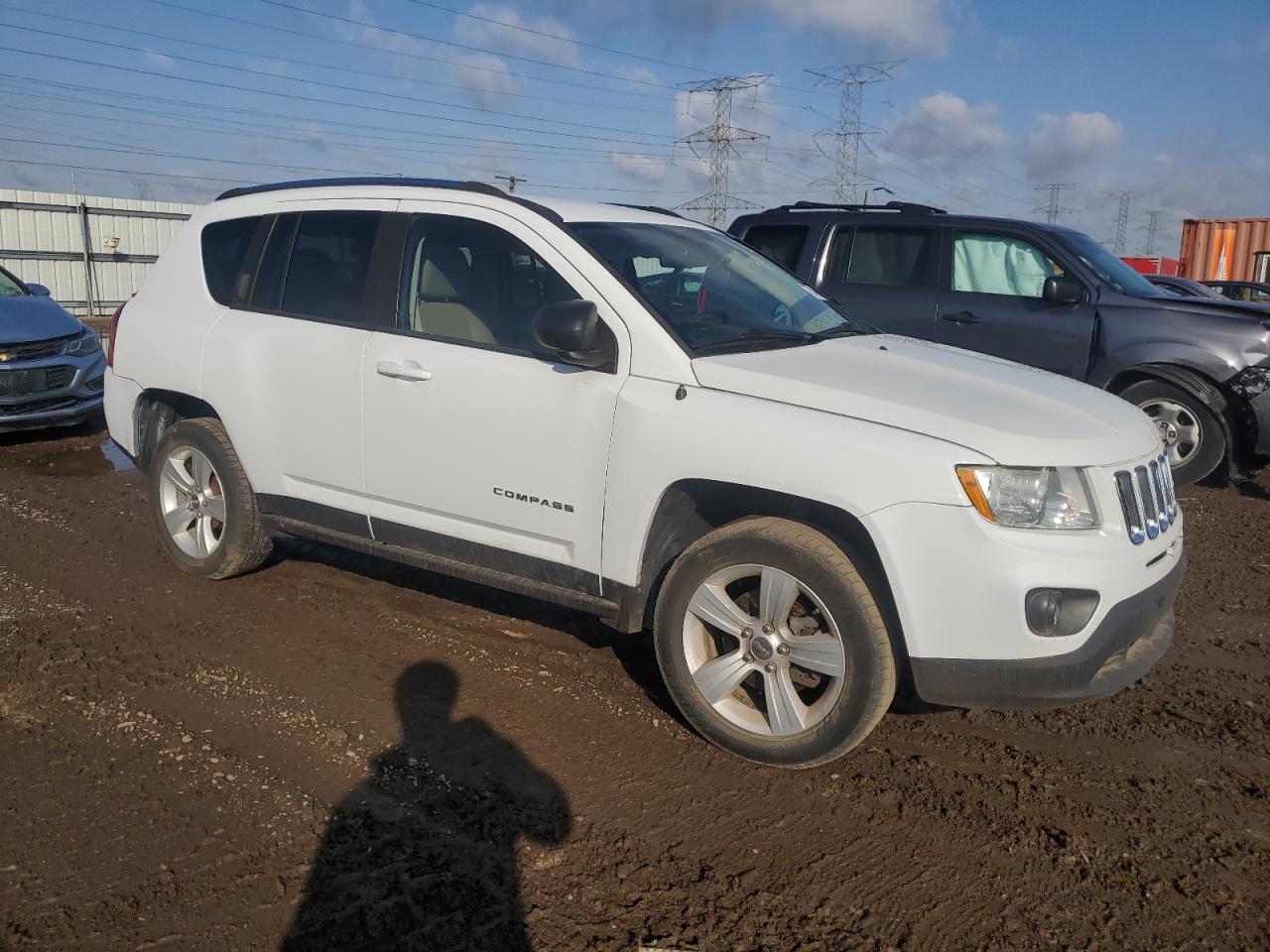 2011 Jeep Compass VIN 1J4NT1FA2BD230700 Copart auction photo, side / rear end damage thumbnail 4