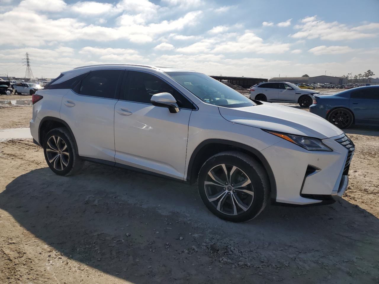 2019 Lexus RX VIN 2T2ZZMCA0KC144774 Copart auction photo, side / minor dent/scratches damage thumbnail 4