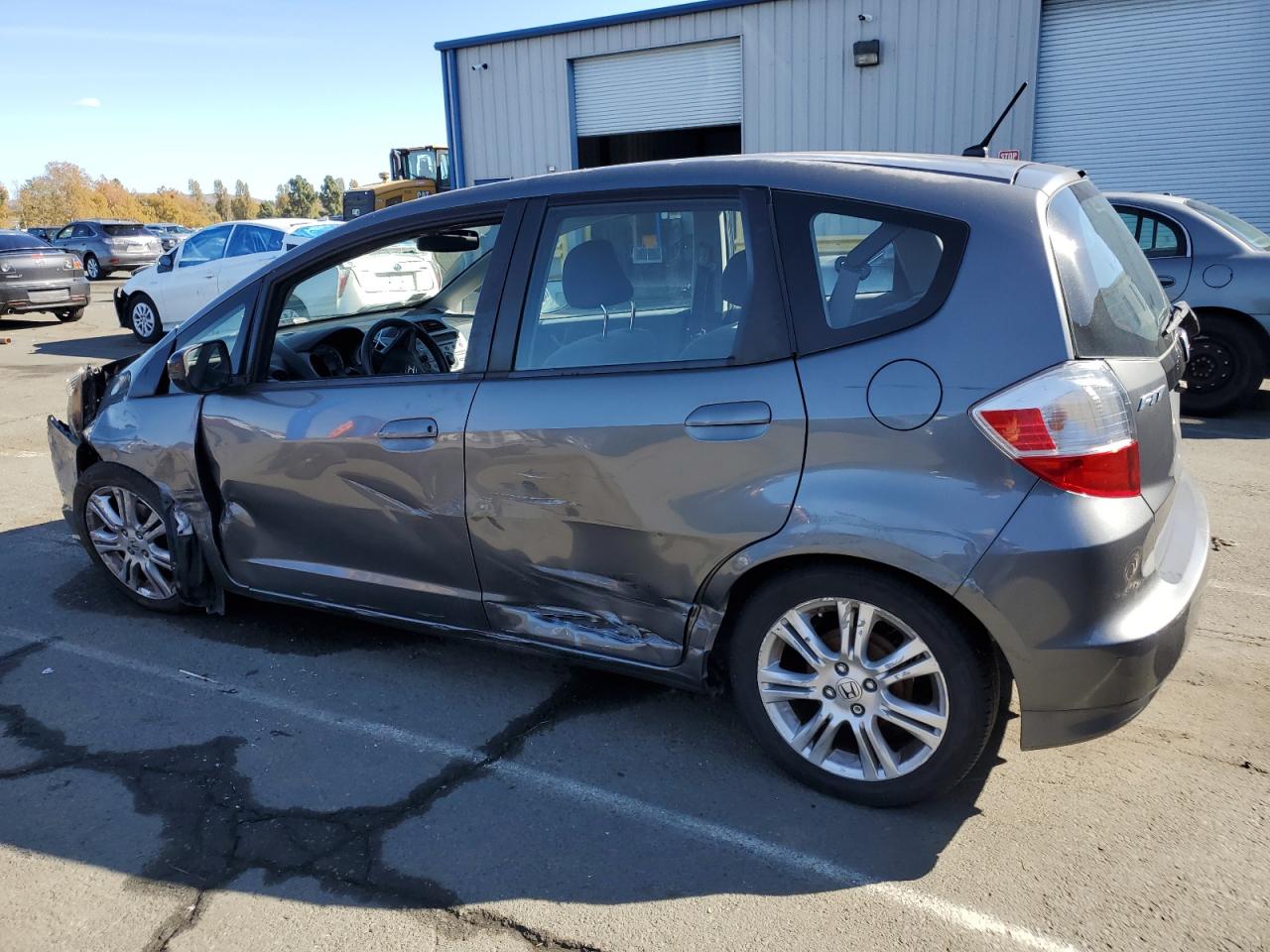 2011 Honda Fit VIN JHMGE8H34BS008279 Copart auction photo, side / all over damage thumbnail 2