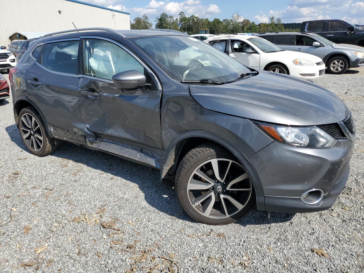 2018 Nissan Rogue VIN JN1BJ1CR9JW291203 Copart auction photo, side / front end damage thumbnail 4