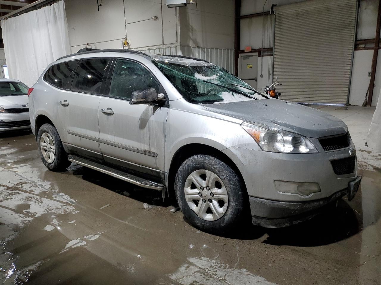 2012 Chevrolet Traverse VIN 1GNKVFED1CJ394199 Copart auction photo, rollover damage thumbnail 4