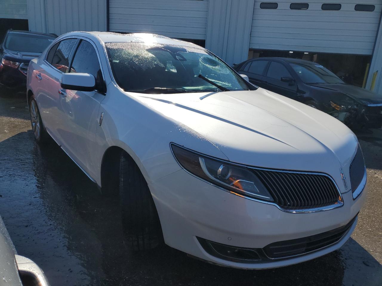 2013 Lincoln MKS VIN 1LNHL9FT1DG600308 Copart auction photo, vandalism damage thumbnail 4