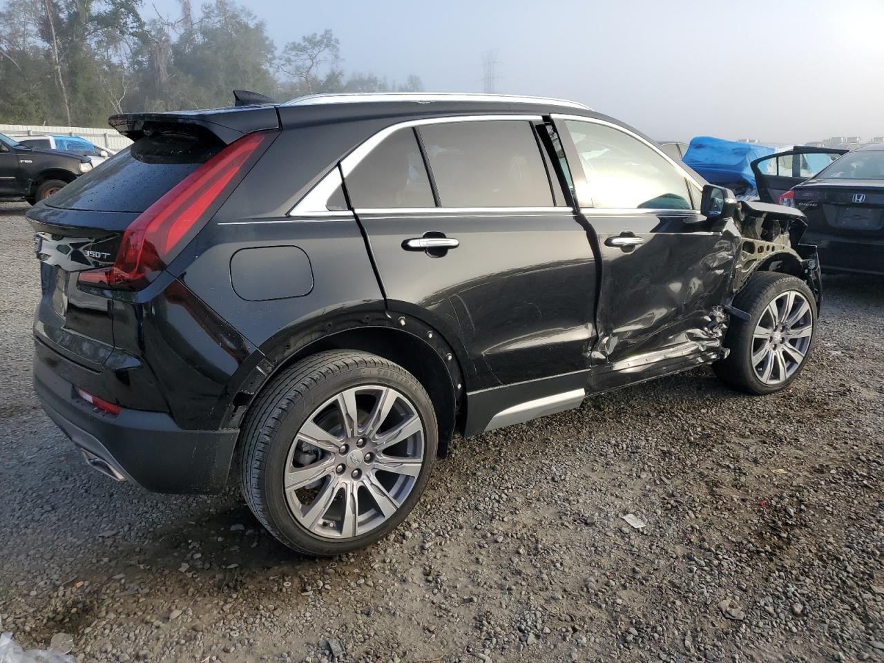 2021 Cadillac XT4 VIN 1GYFZCR45MF071392 Copart auction photo, side / front end damage thumbnail 3