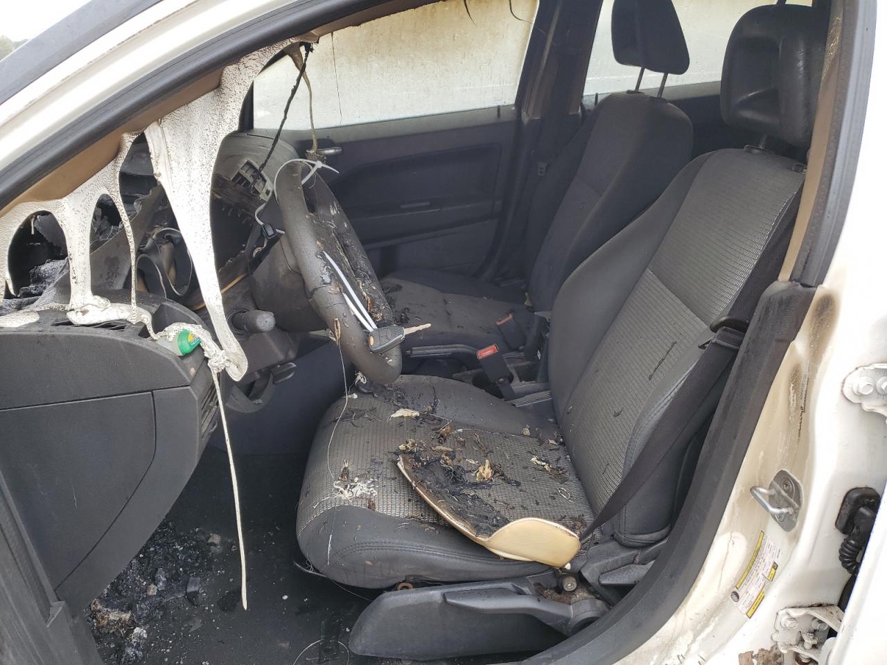2009 Dodge Caliber VIN 1B3HB48A29D147588 Copart auction photo, burn damage thumbnail 7
