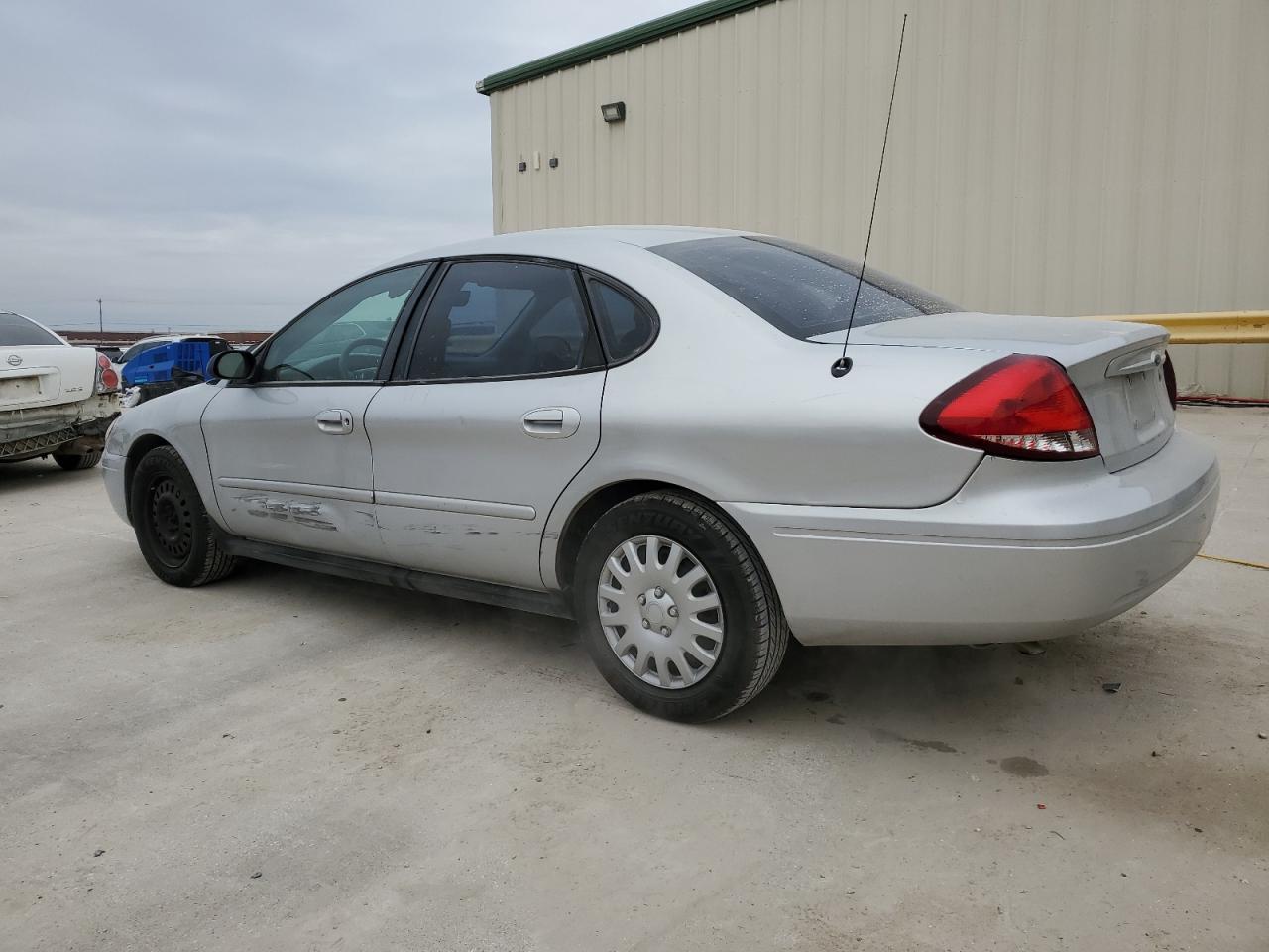 2004 Ford Taurus VIN 1FAFP52224A203303 Copart auction photo, side / minor dent/scratches damage thumbnail 2