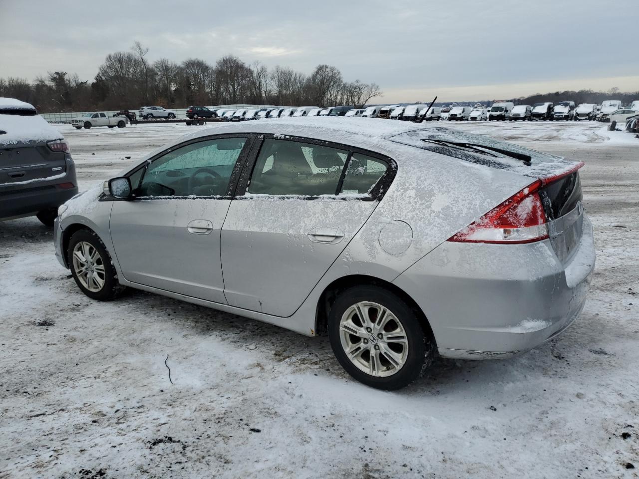 2010 Honda Insight VIN JHMZE2H71AS009851 Copart auction photo, front end / minor dent/scratches damage thumbnail 2