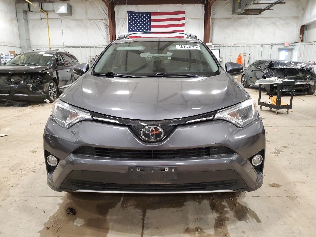 2018 Toyota RAV 4 VIN 2T3RFREV8JW848445 Copart auction photo, side damage thumbnail 5