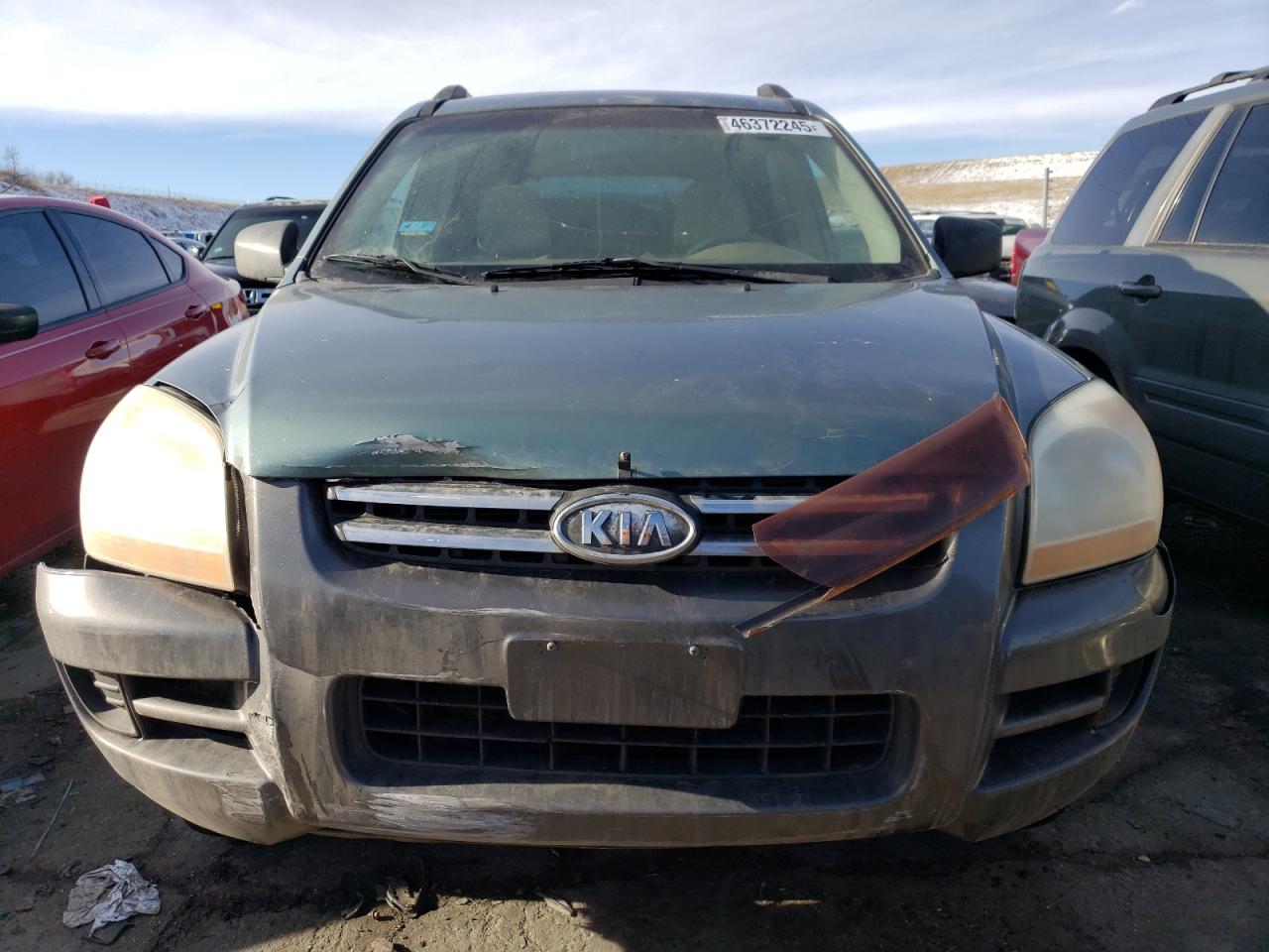 2007 KIA Sportage VIN KNDJF724577435674 Copart auction photo, front end / hail damage thumbnail 5