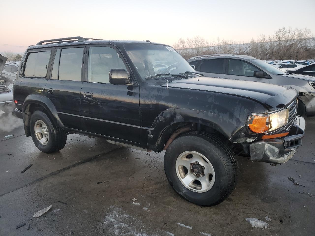 1997 Toyota Land Cruiser VIN JT3HJ85J7V0156824 Copart auction photo, front end damage thumbnail 4