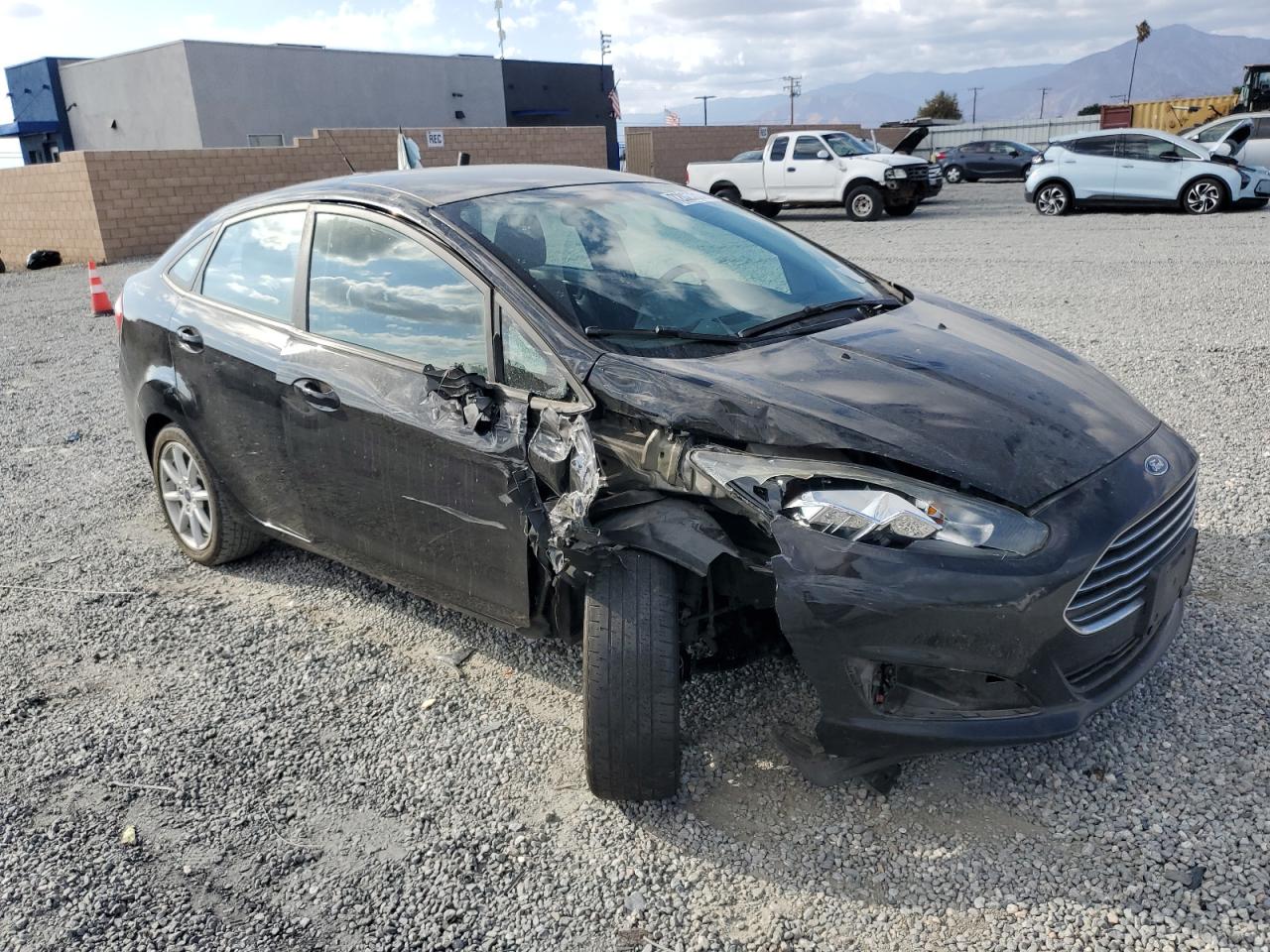 2019 Ford Fiesta VIN 3FADP4BJ1KM164258 Copart auction photo, side / front end damage thumbnail 4