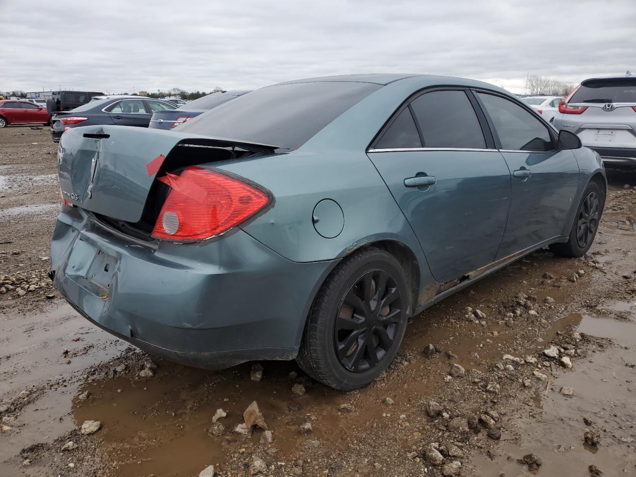 2009 Pontiac G6 VIN 1G2ZG57B994223803 Copart auction photo, rear end / minor dent/scratches damage thumbnail 3